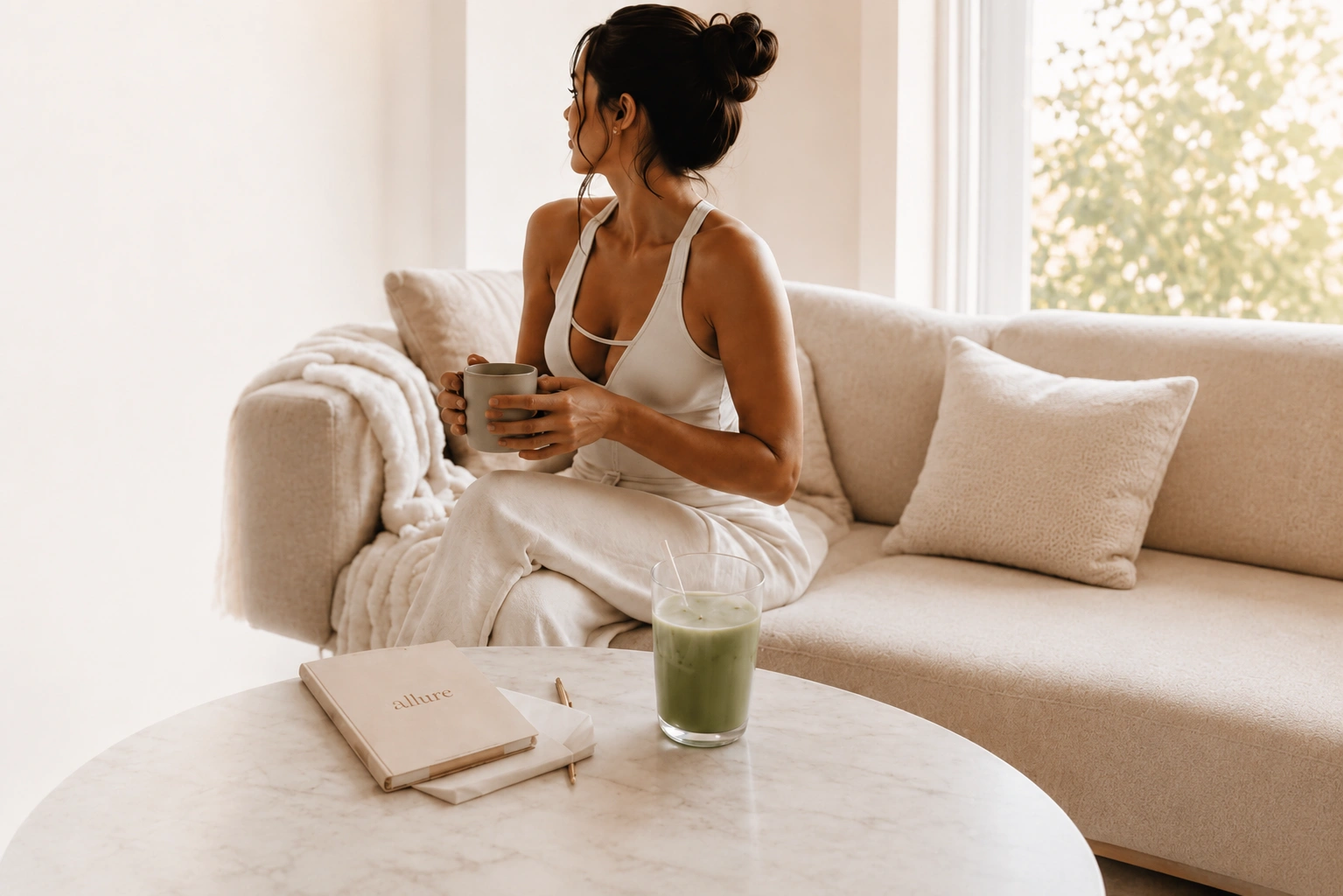 Woman relaxing with coffee on a sofa